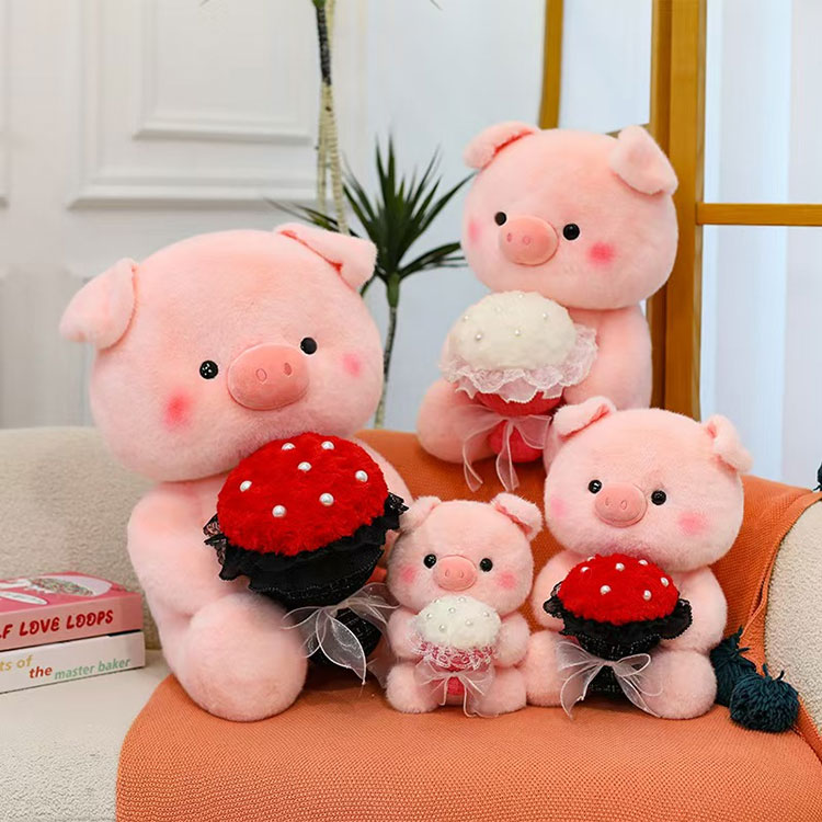ตุ๊กตาหมูสีชมพูถือดอกไม้